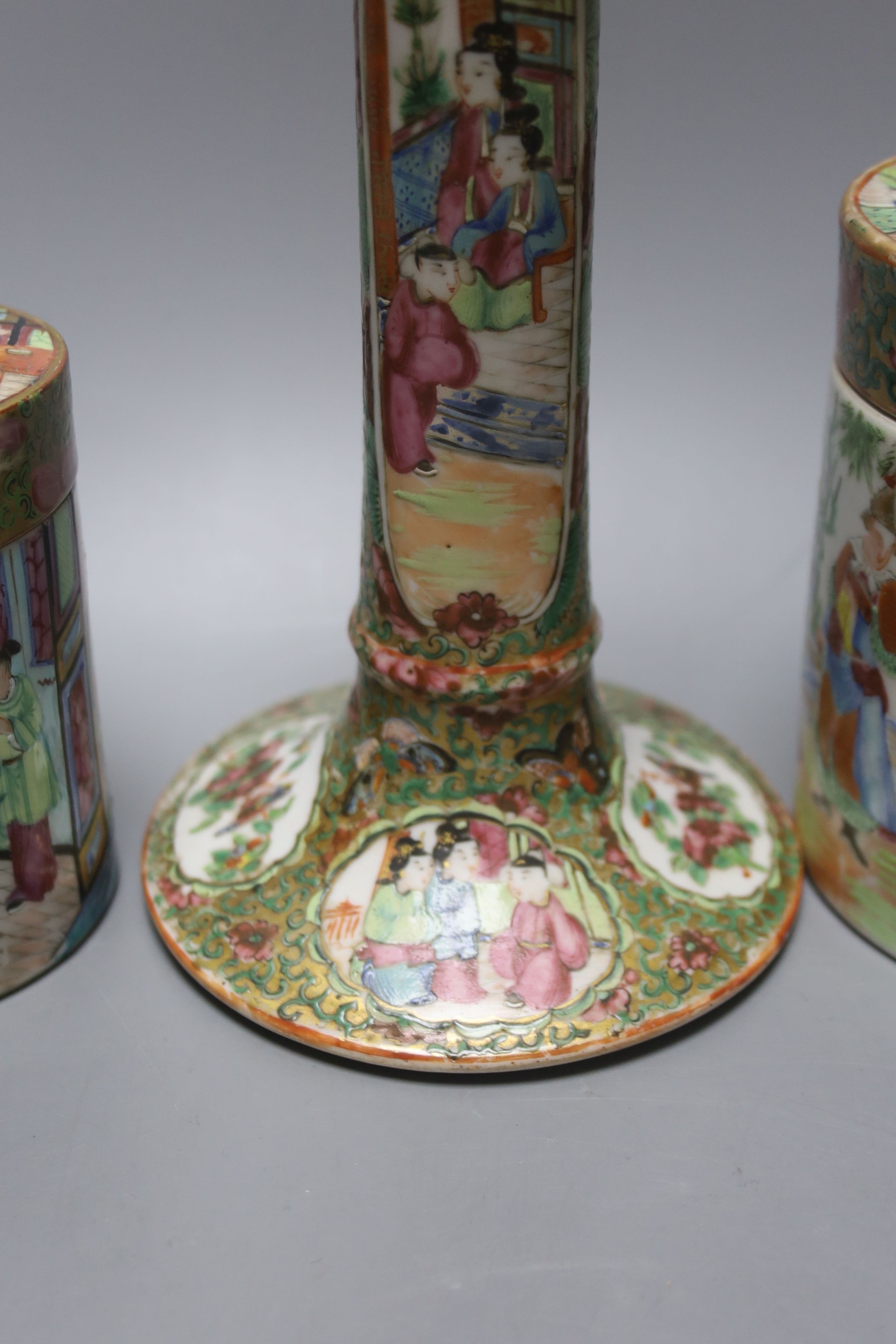 A Chinese Canton famille rose nest of boxes and covers, a similar candlestick and a tray 23cm